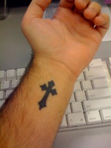 solid-black-cross-tattoo-on-wrist