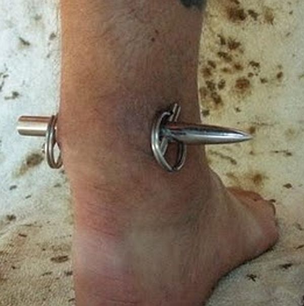 Bizarre leg piercing