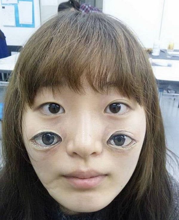 Eyes on face tattoo