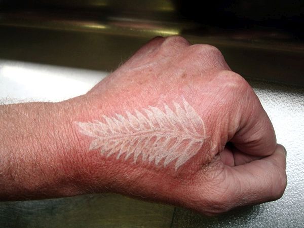 Fern white ink tattoo